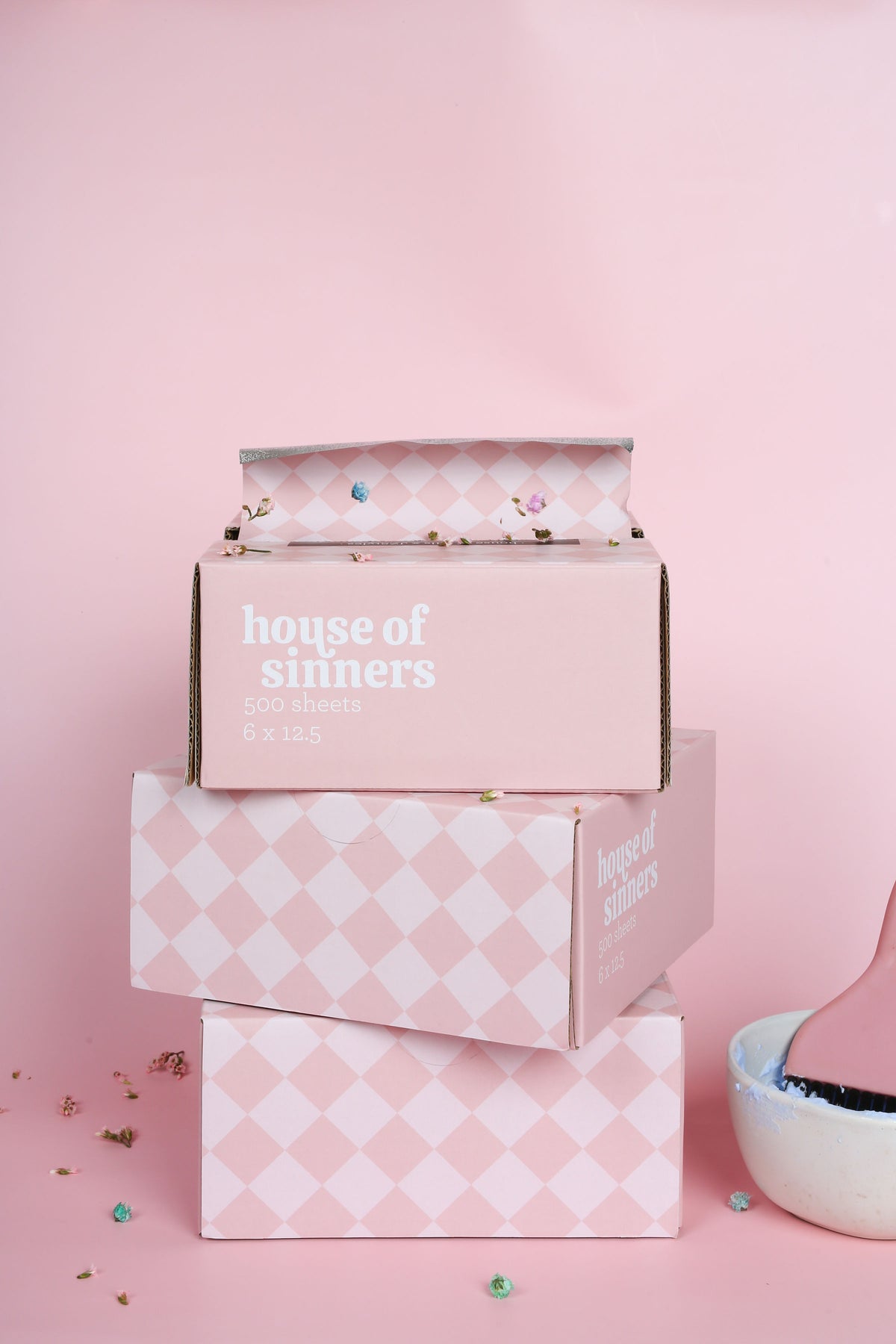 House of Sinners pink checker pattern hair foils in use at salon