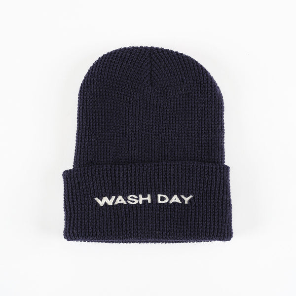 Black beanie with 'WASH DAY' text on a white background