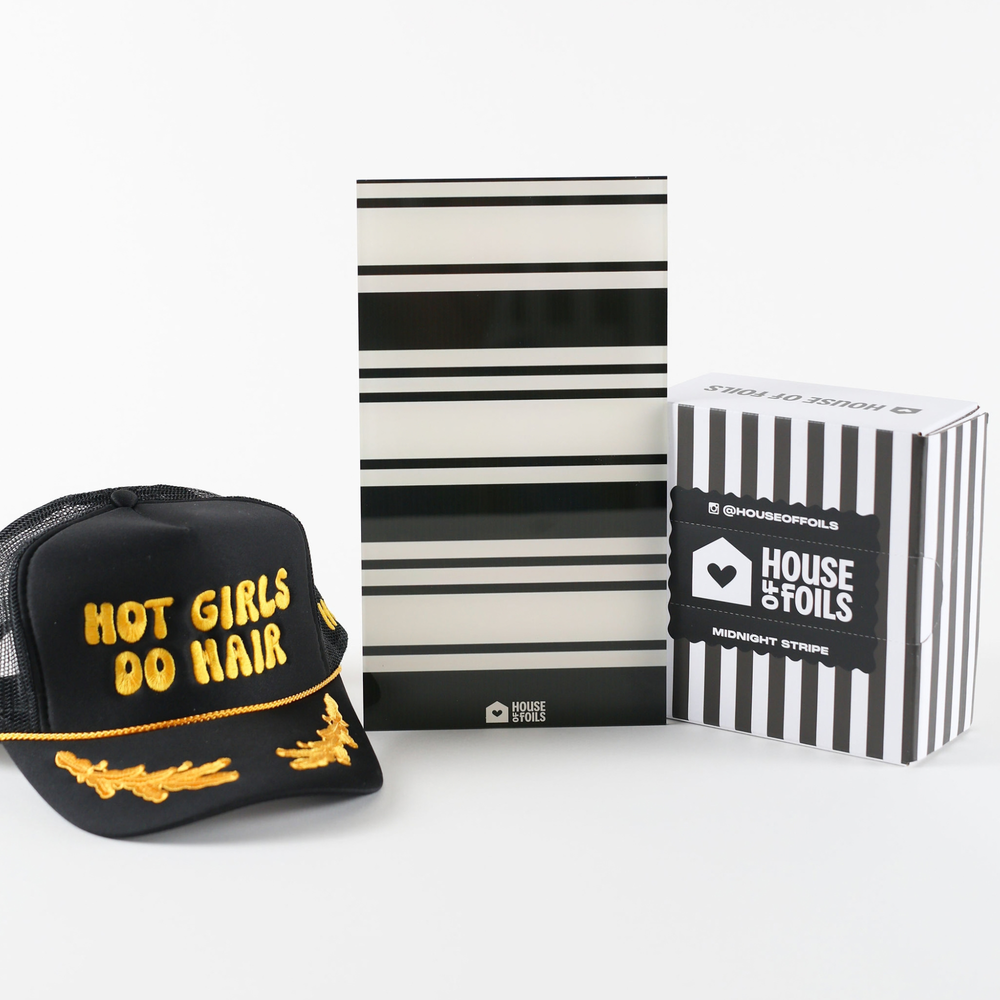The Wicked Bundle with the black Hot Girls Do Hair hat, Retro Stripe balayage board and a box of Midnight Stripe foil