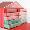 Angled view of the 10 Days of Sleigh advent calendar with the numbered mystery foil boxes stacked inside