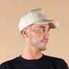 Tan beige Babylighting My Back Out Hat worn by hair stylist in salon