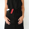 HOF Everyday Apron in black worn by hair stylist in salon