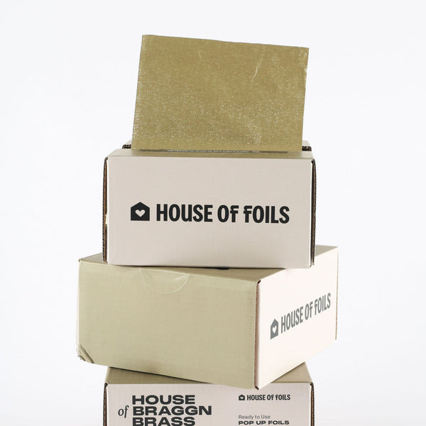 House of Braggn Brass foil sheets fanned out showing full print