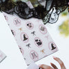 Hand holding open a box of Haunted Mansion Halloween print hair foil