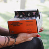 Hand holding an open orange House of Foils box of Monster Mash Halloween print foil