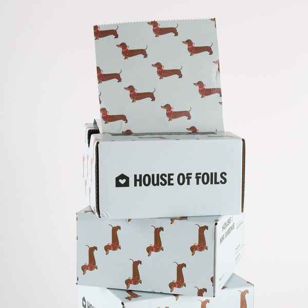 House of Mr Weenie foil sheets fanned out showing dachshund print