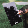 Stylist holding the black Midnight Balayage Board outdoors