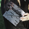 House of Batties foil sheets held up showing the silver foil backing and bat print