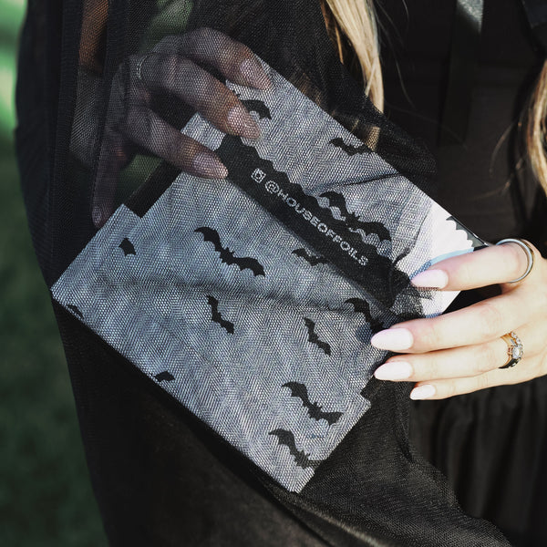 House of Batties foil sheets held up showing the silver foil backing and bat print
